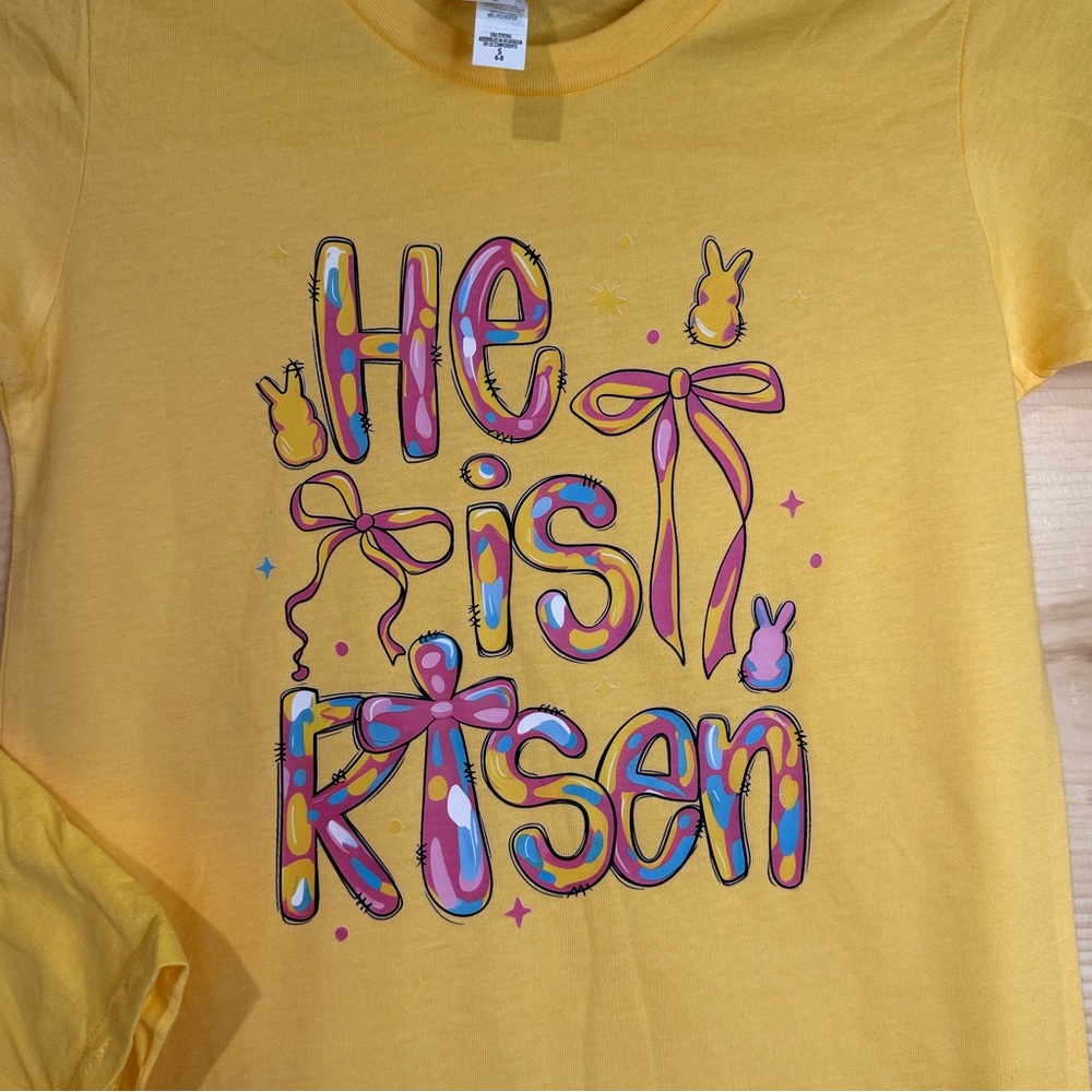Bella Canvas Yellow Kids 'He Is Risen' Graphic Tee with Multicolor Print